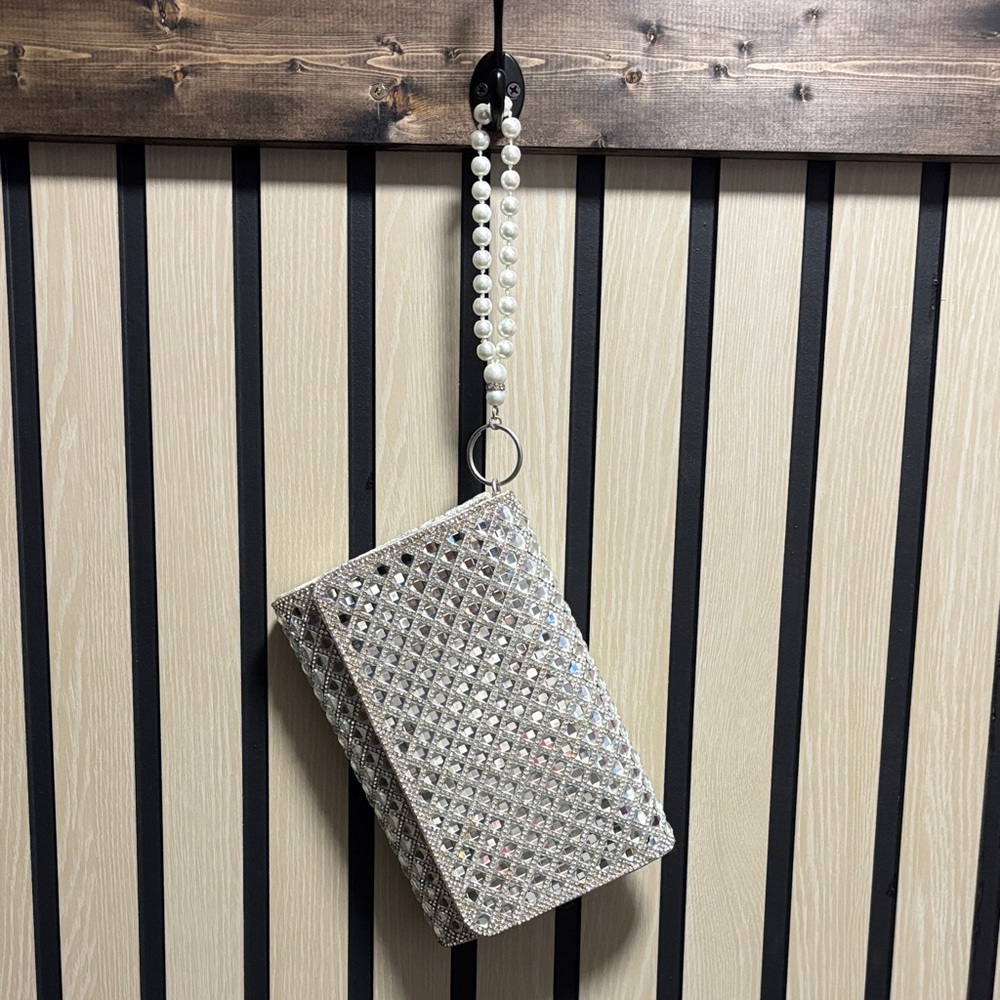 Elegant Silver Clutch with Pearl Strap